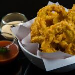 Pastella dorata e croccante per calamari fritti, preparata con ingredienti freschi e tecnica professionale.